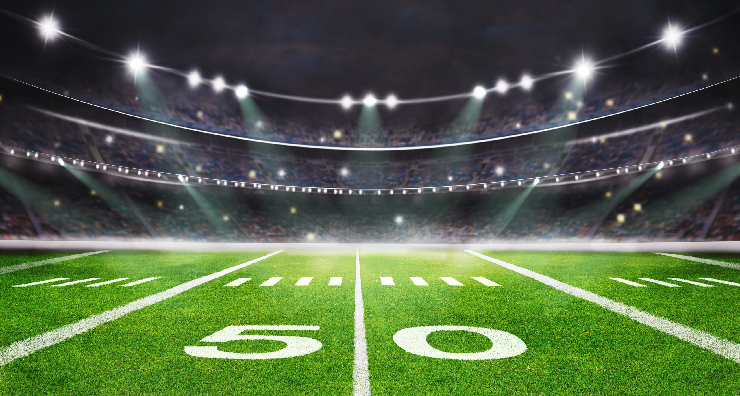 green field in american football stadium. ready for game